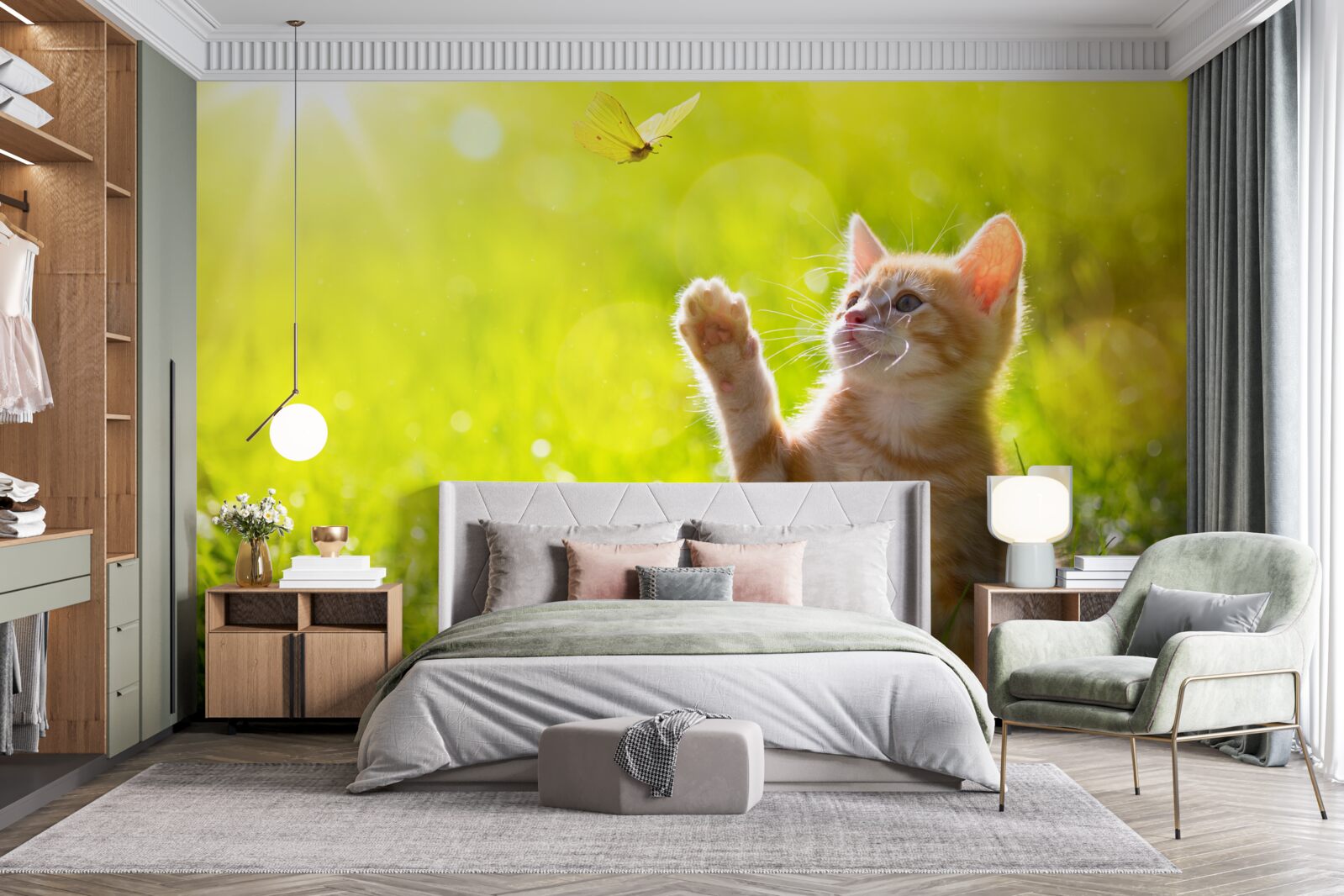 Fototapet o pisică mică se joacă cu un fluture pe un câmp verde