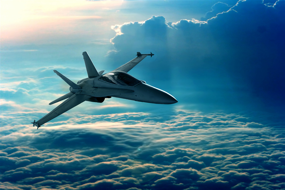 Fototapet avion de vânătoare care trece prin nori